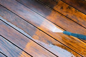 Pressure washing wood surface by Complete Power Wash